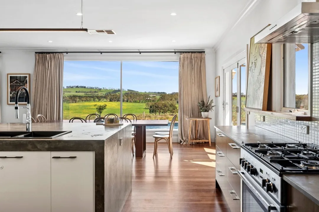 Kitchen, dining and picture window in Tom and Emma Hawkins' rural home.