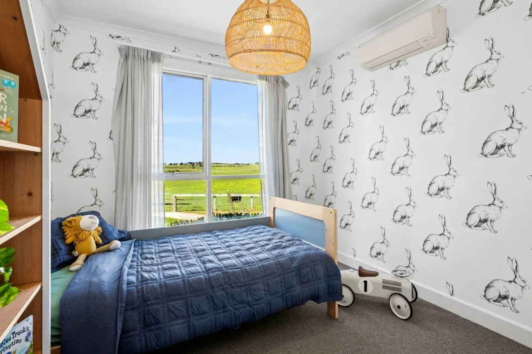 Kids room featuring rabbit wallpaper in Tom and Emma Hawkins' farmhouse.