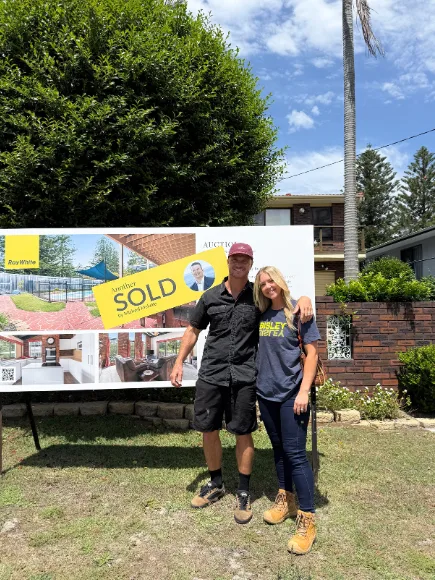 Kyal and Kara outside their new renovation project.