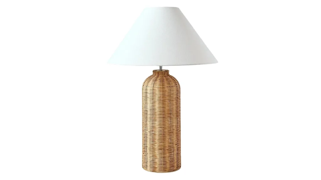 A table lamp with a rattan base.