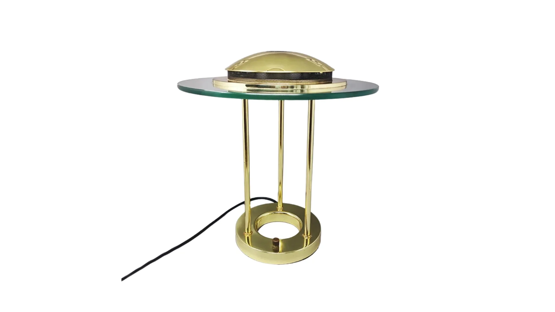 A table lamp that has a gold finish