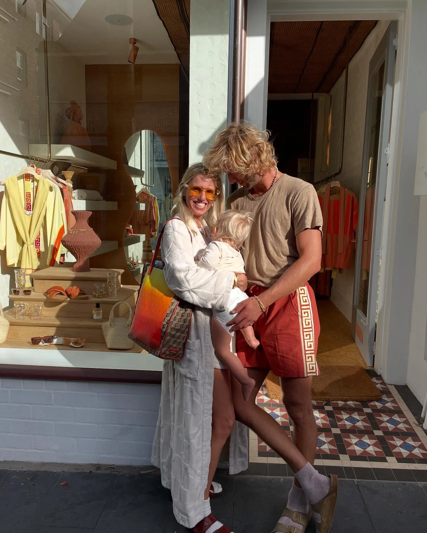 Lucy Folk with her partner and child