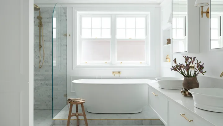 A luxurious ensuite with a freestanding bath.