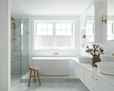 A luxurious ensuite with a freestanding bath.