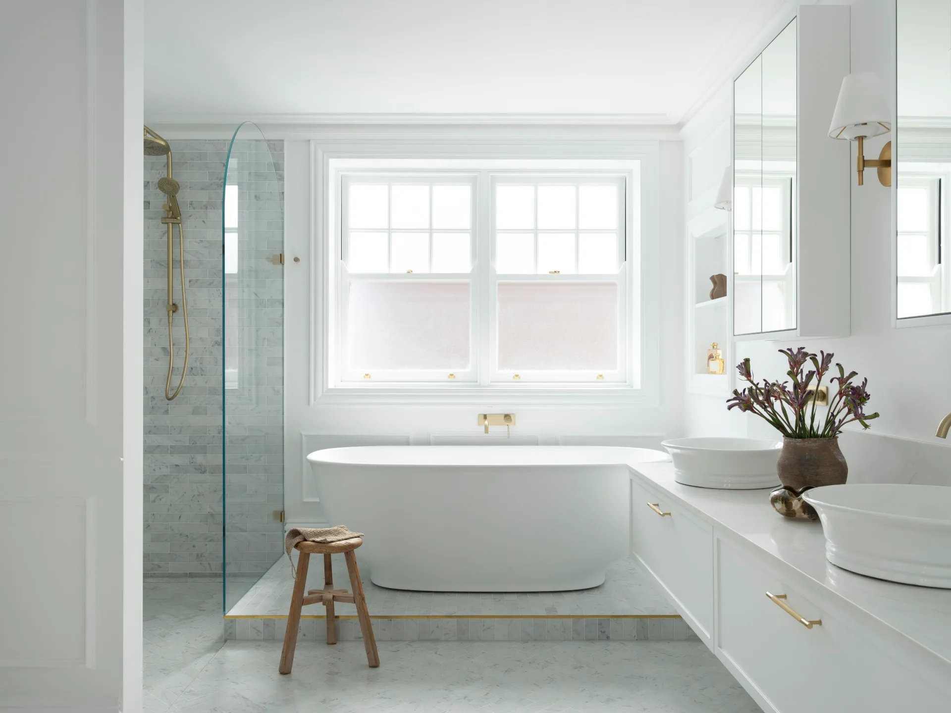 A luxurious ensuite with a freestanding bath.