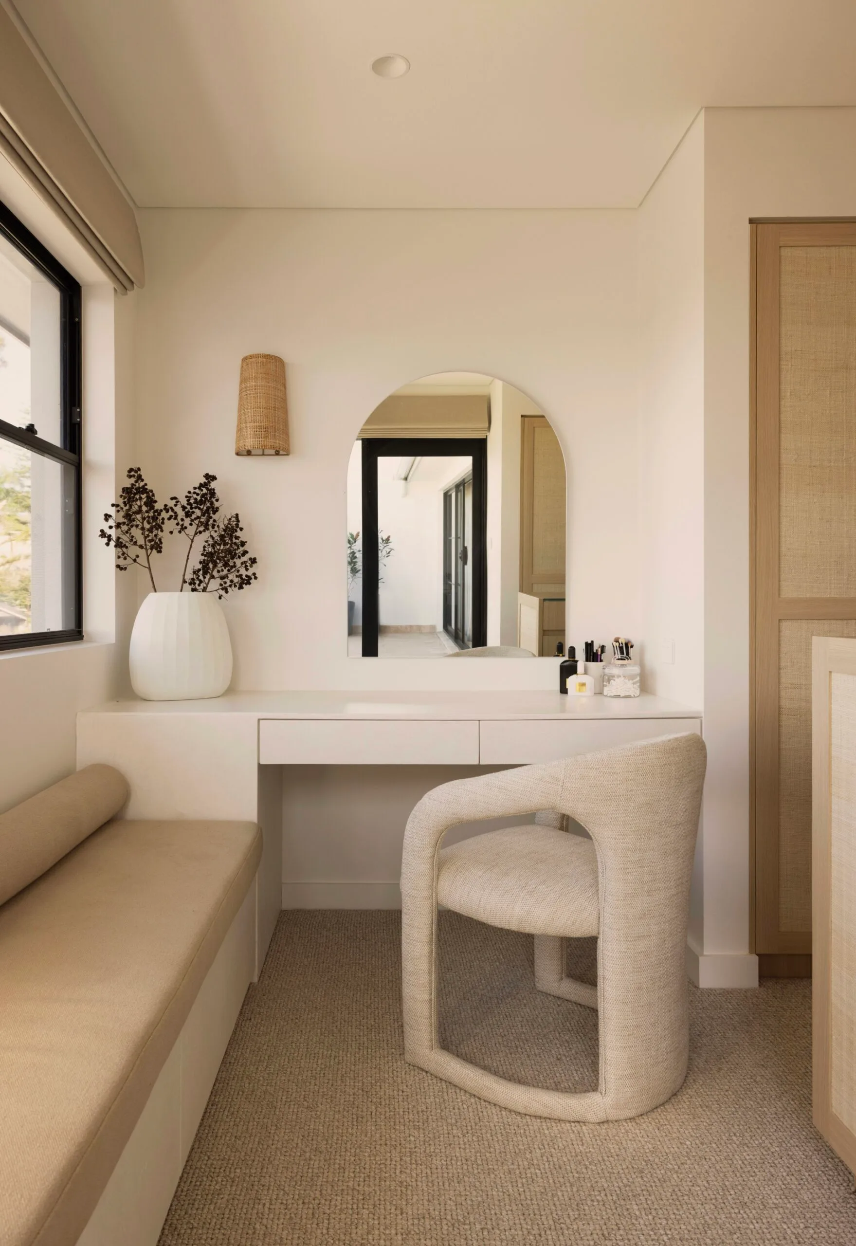 Dressing table in the walk-in robe of a Sydney coastal house with a neutral, beige Mediterranean aesthetic