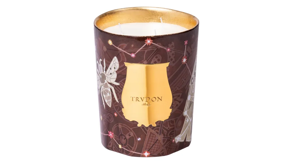 A trudon candle with stars on the sides