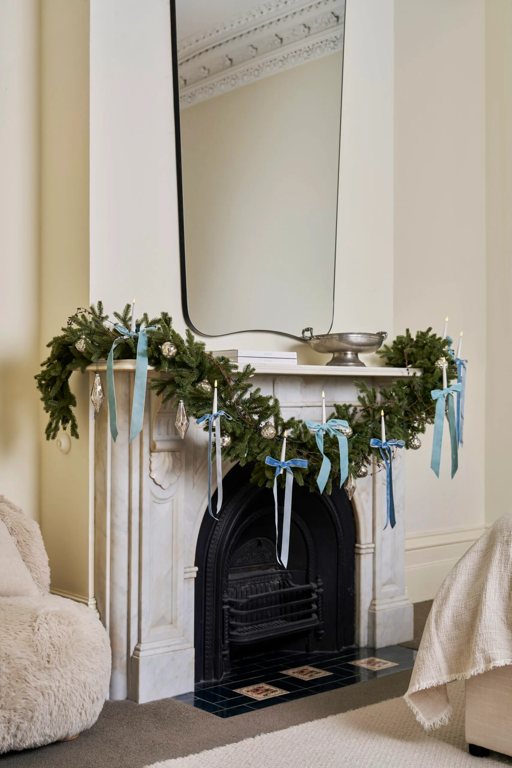 The blue christmas trend displayed along a mantle.