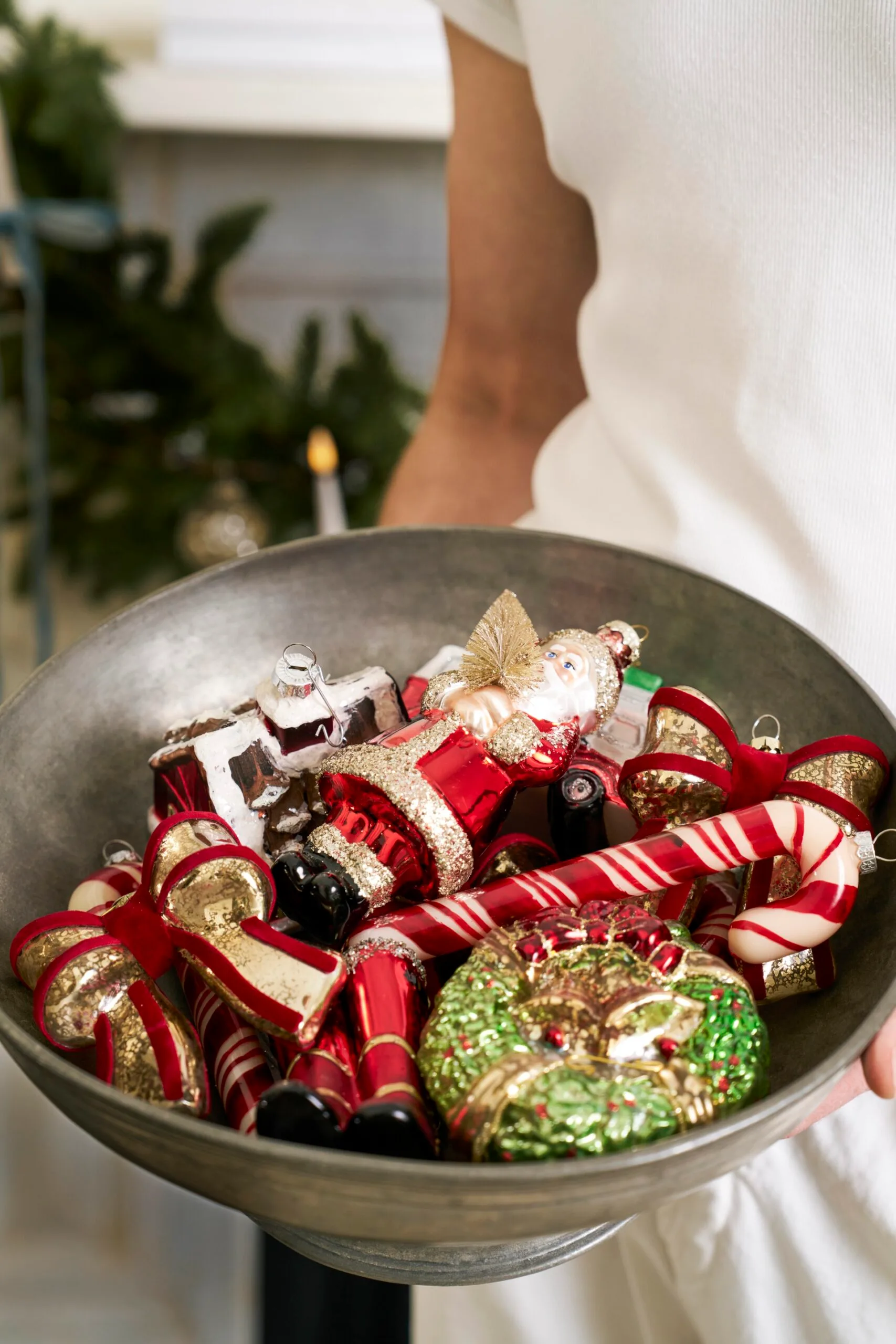A bowl of Christmas decorations from Pottery Barn. 