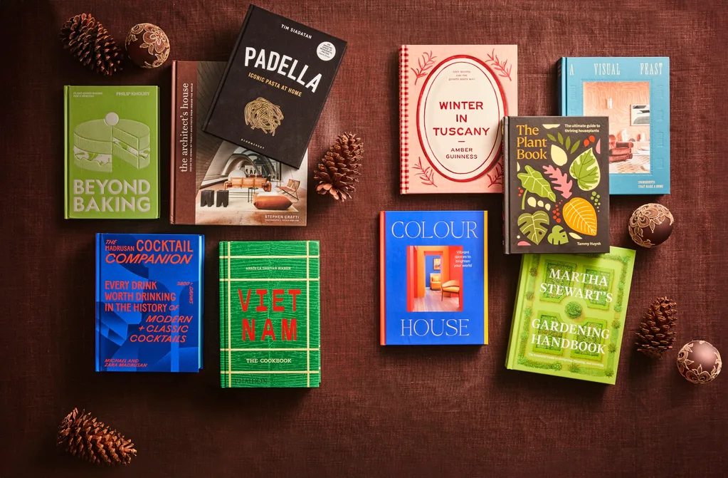 Interiors, gardening and recipe books lying on a brown fabric.