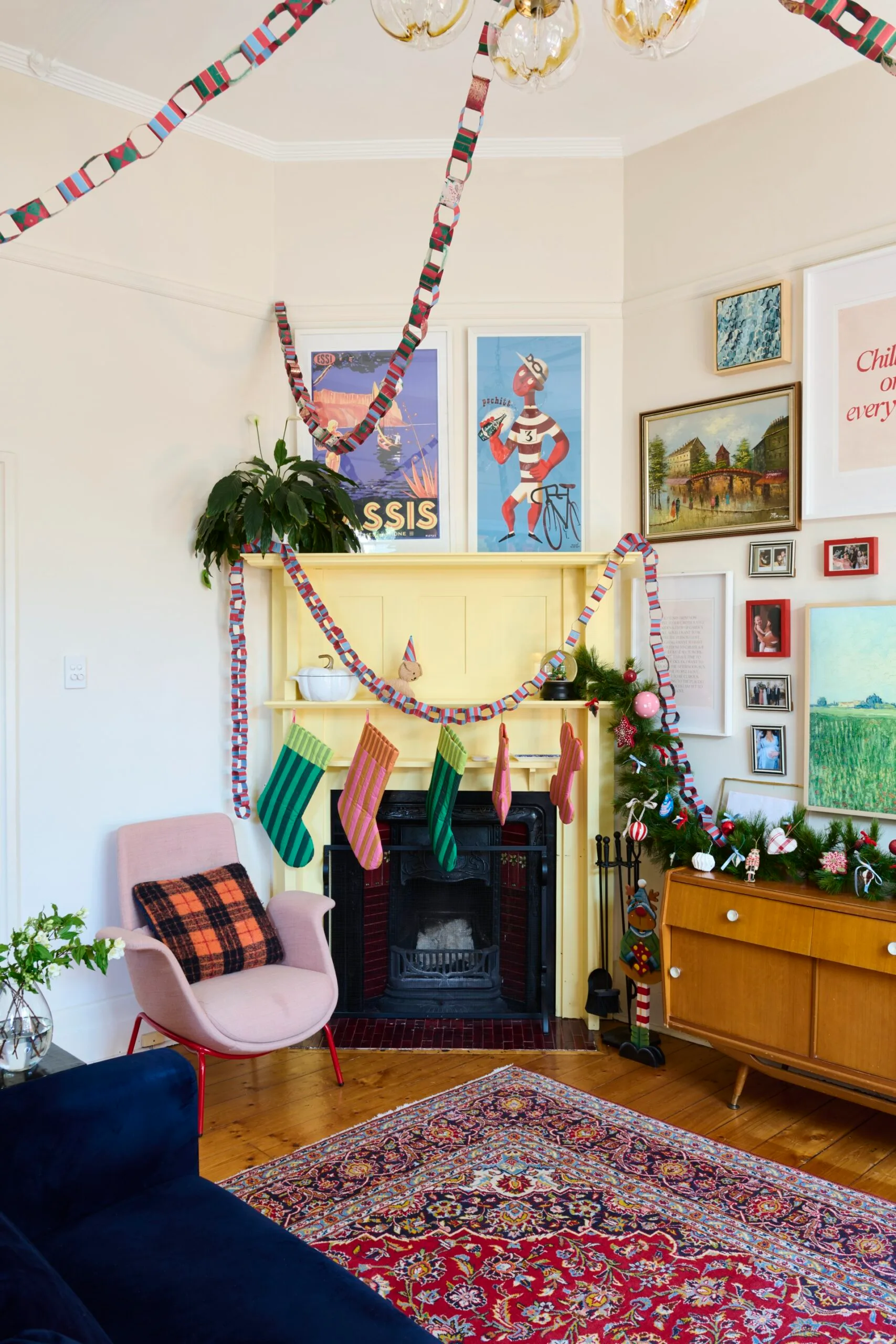 Jess Ngyuyen decorating her Christmas tree with her son.