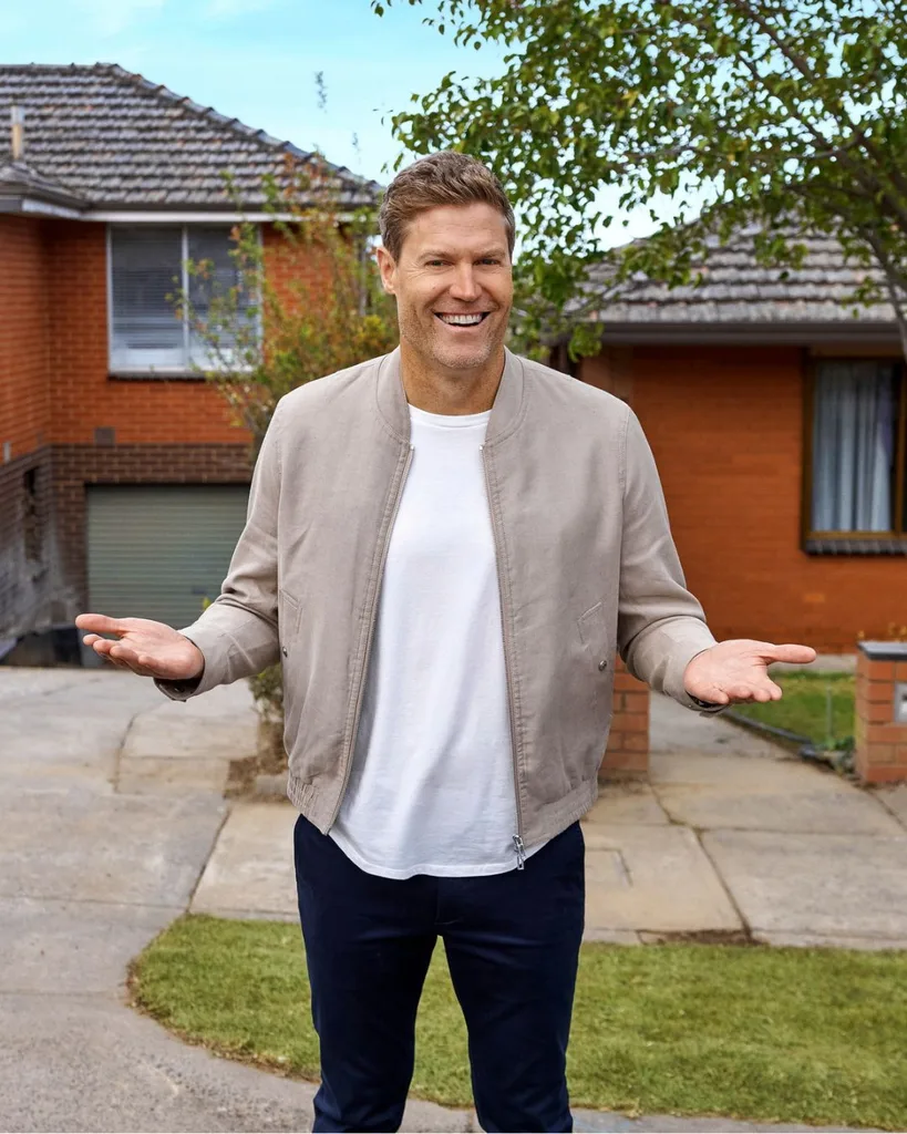 my reno rules host chris brown poses outside the my reno rules homes