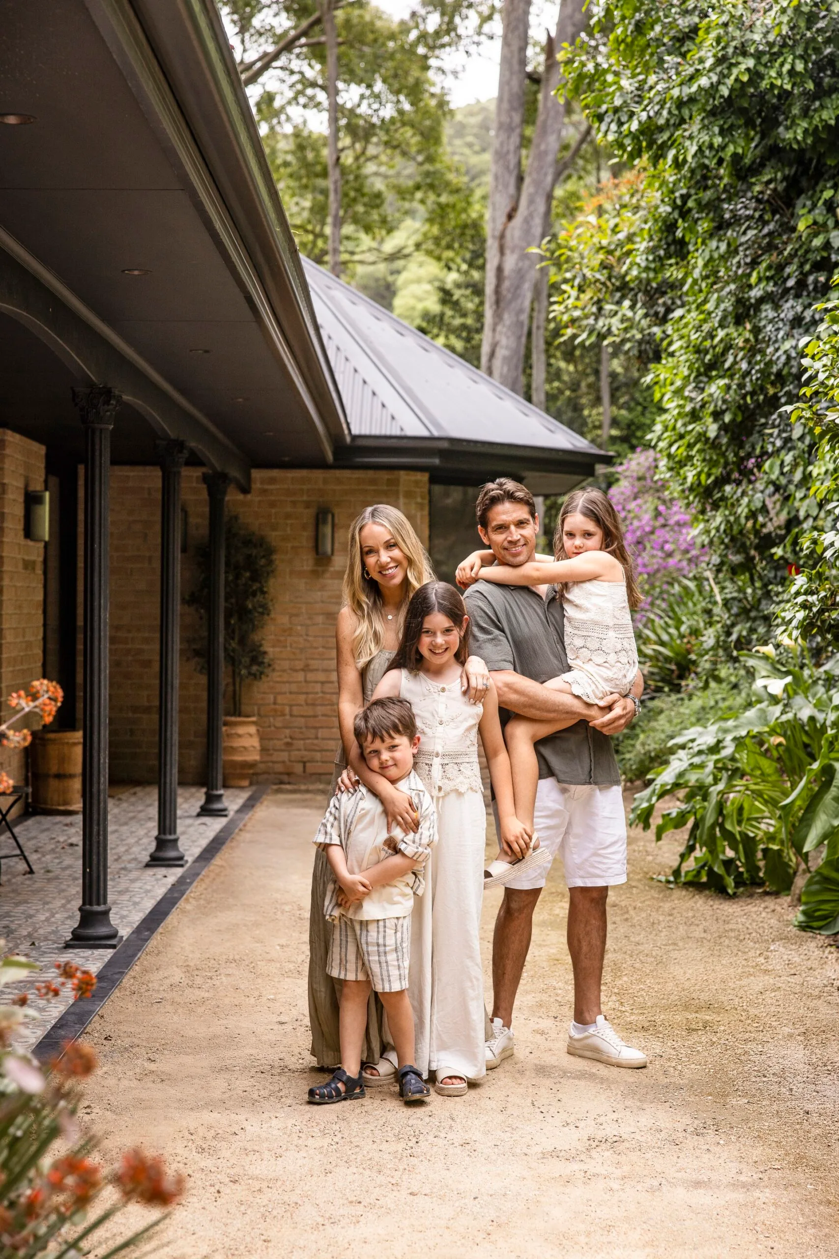 Rachel and Ryan Carr with their three children at their South Coast holiday house.