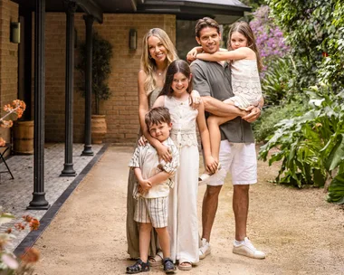 Rachel and Ryan Carr with their three children at their South Coast holiday house.