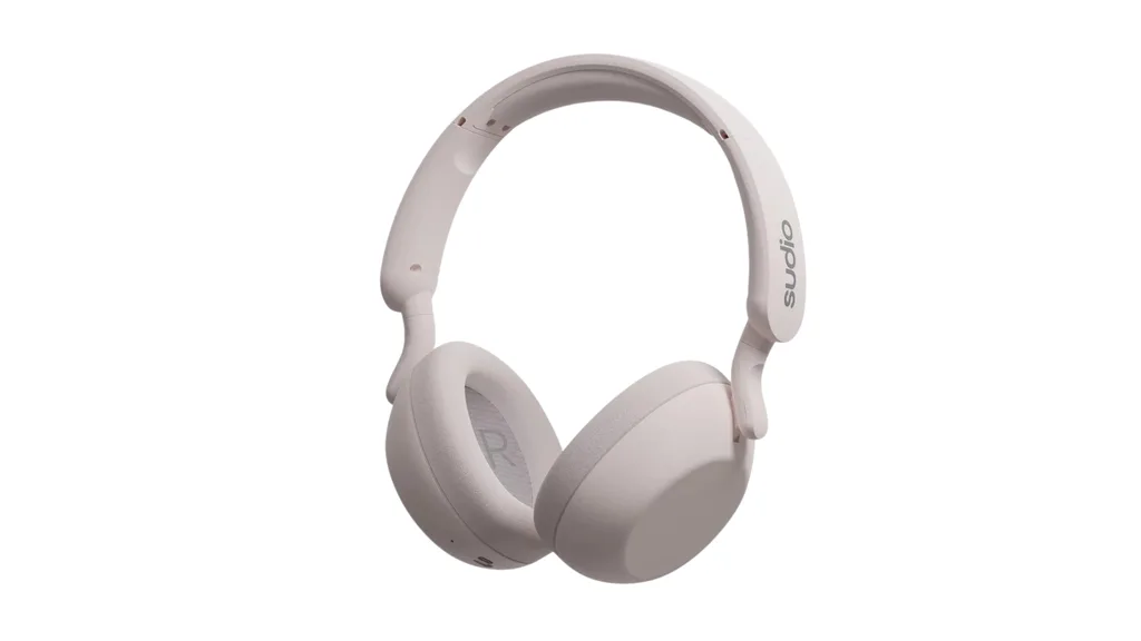 Over the ear headphones in a soft pink, almost white shade