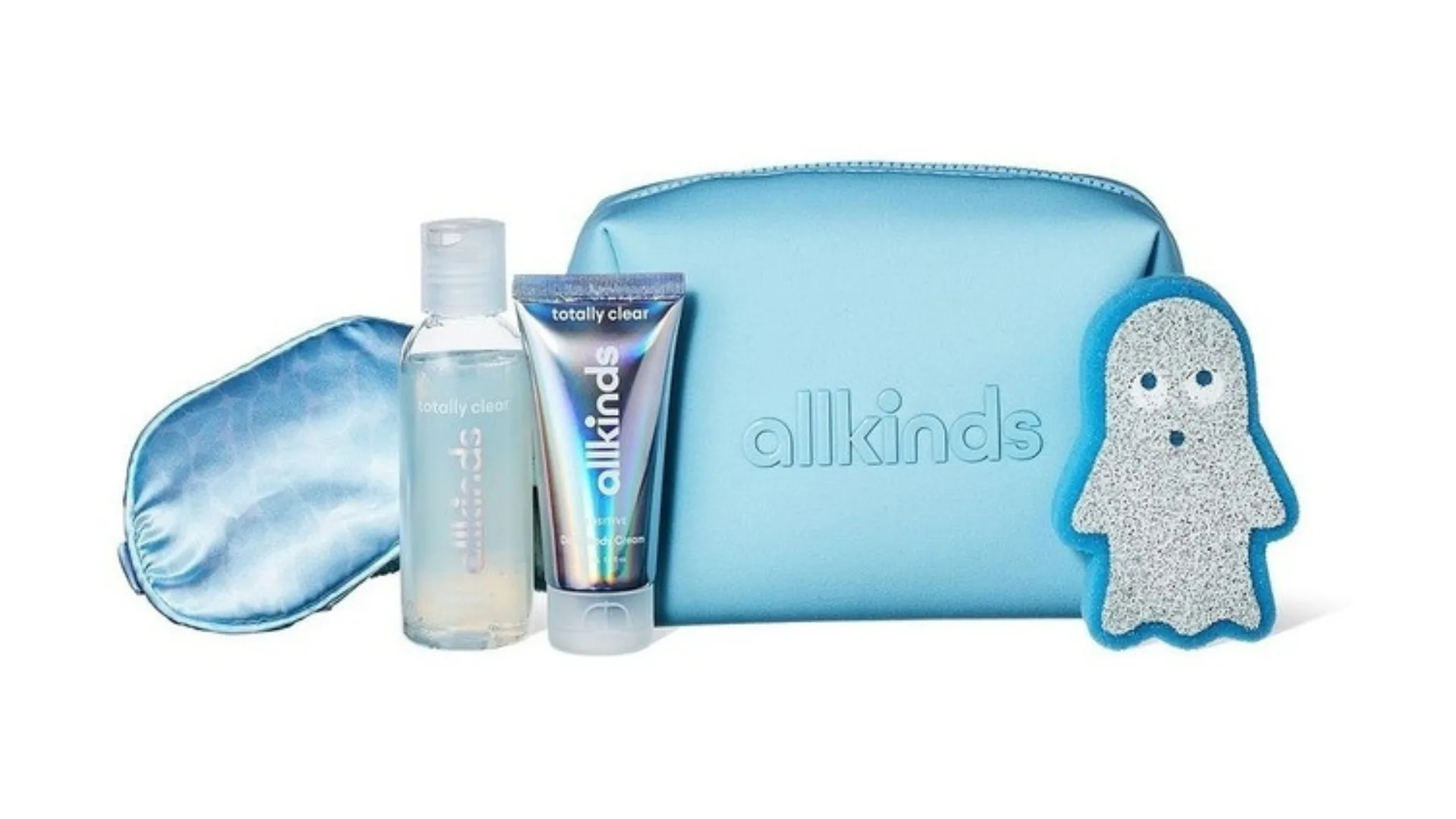 A blue toiletry bag with a blue sleep mask and two blue body wash and body cream products.