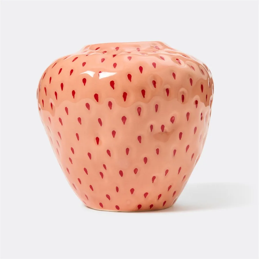 This piece perfectly captures the plump, dimpled texture and rosy hue of a freshly picked strawberry. Its whimsical yet chic design makes it an instant focal point, whether holding a bouquet of wildflowers or standing alone as a piece of sculptural art.