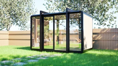 a rendering of a Bunnings tiny home by Elsewhere Pods sitting in a backyard with green grass and leafy trees
