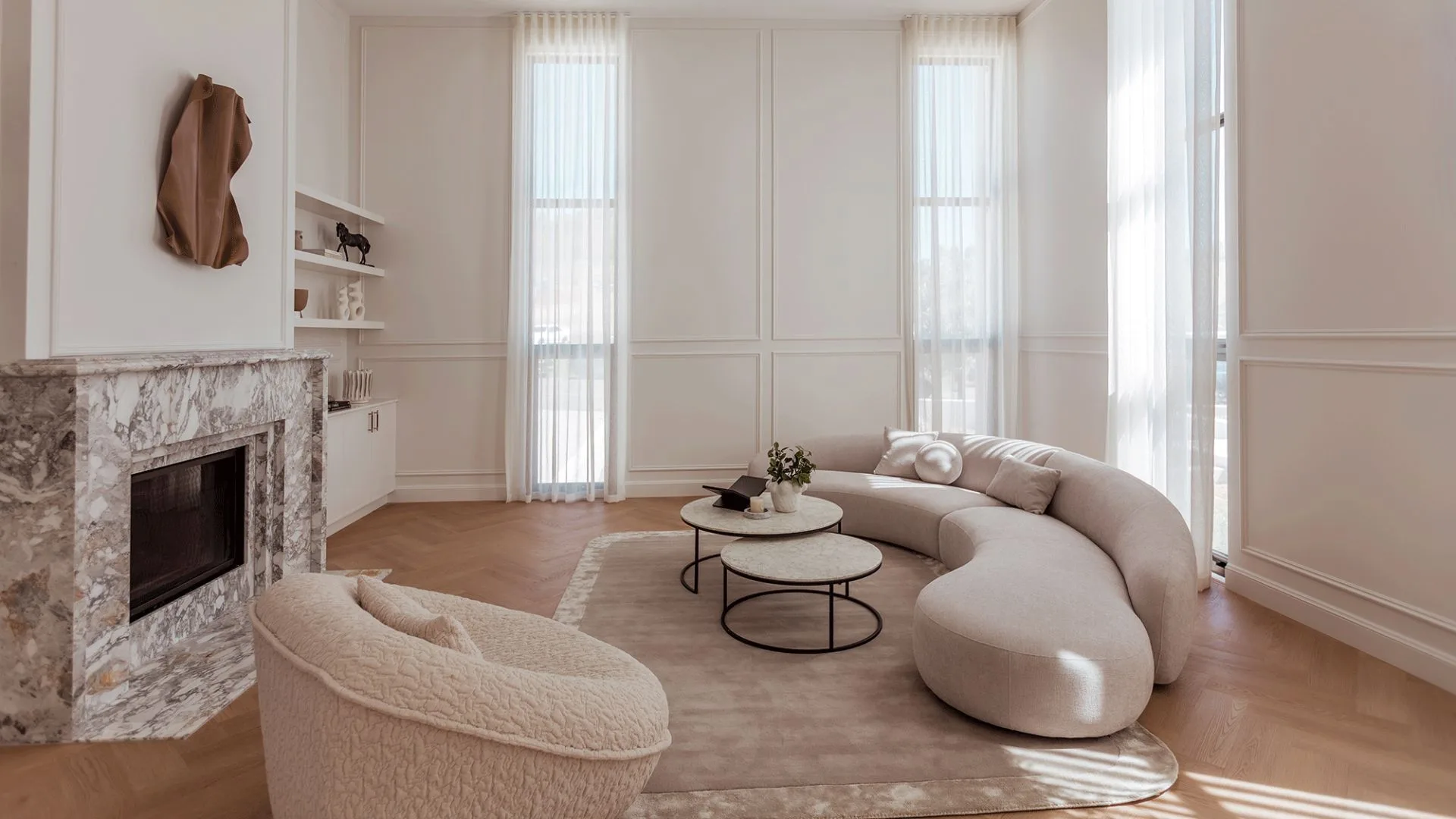 King Home living room with luxaflex curtains, curved couch and fireplace 