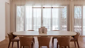 Luxaflex curtains showing in king home's dining space