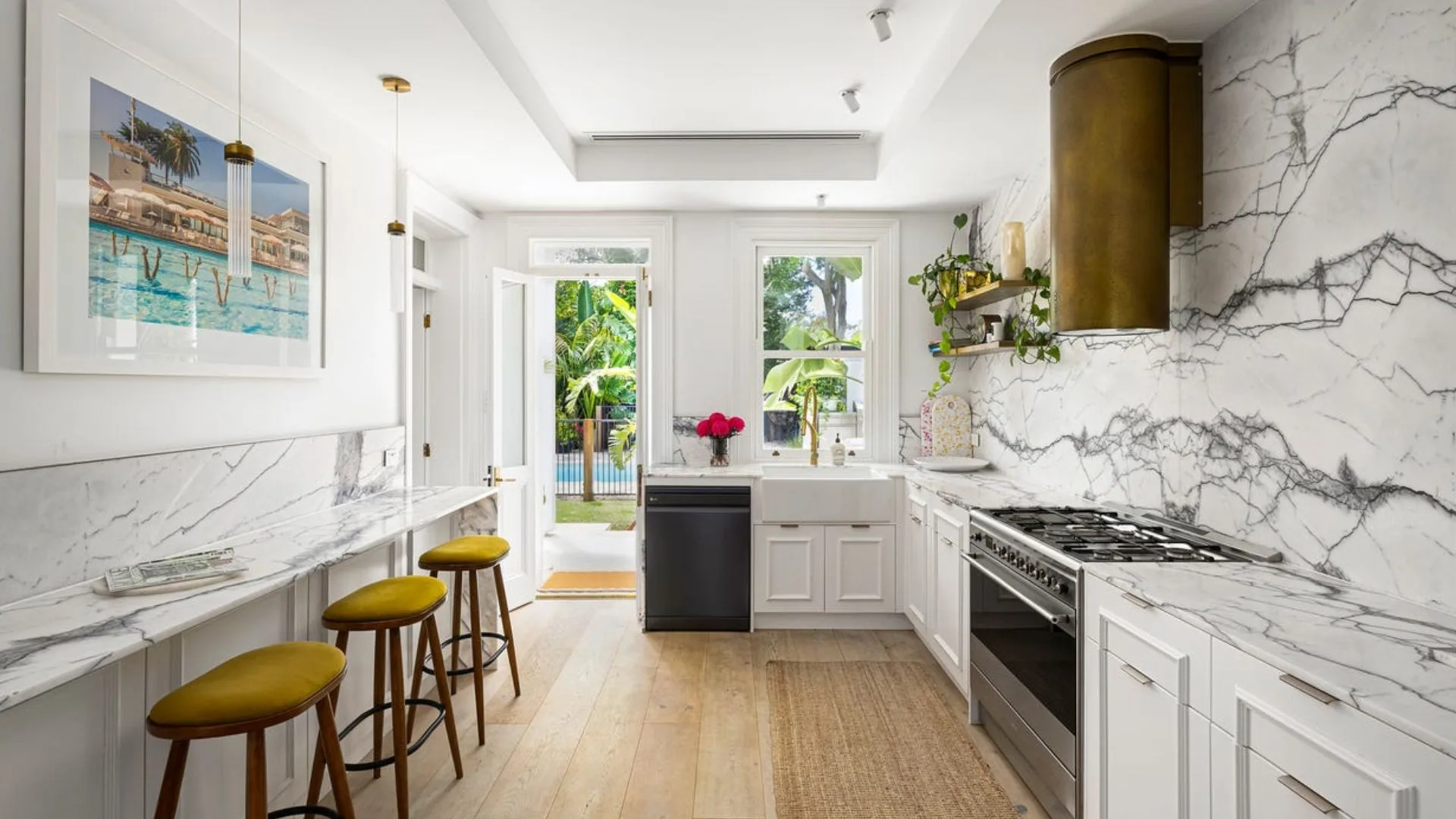 John Aiken home for sale kitchen with marble feature wall
