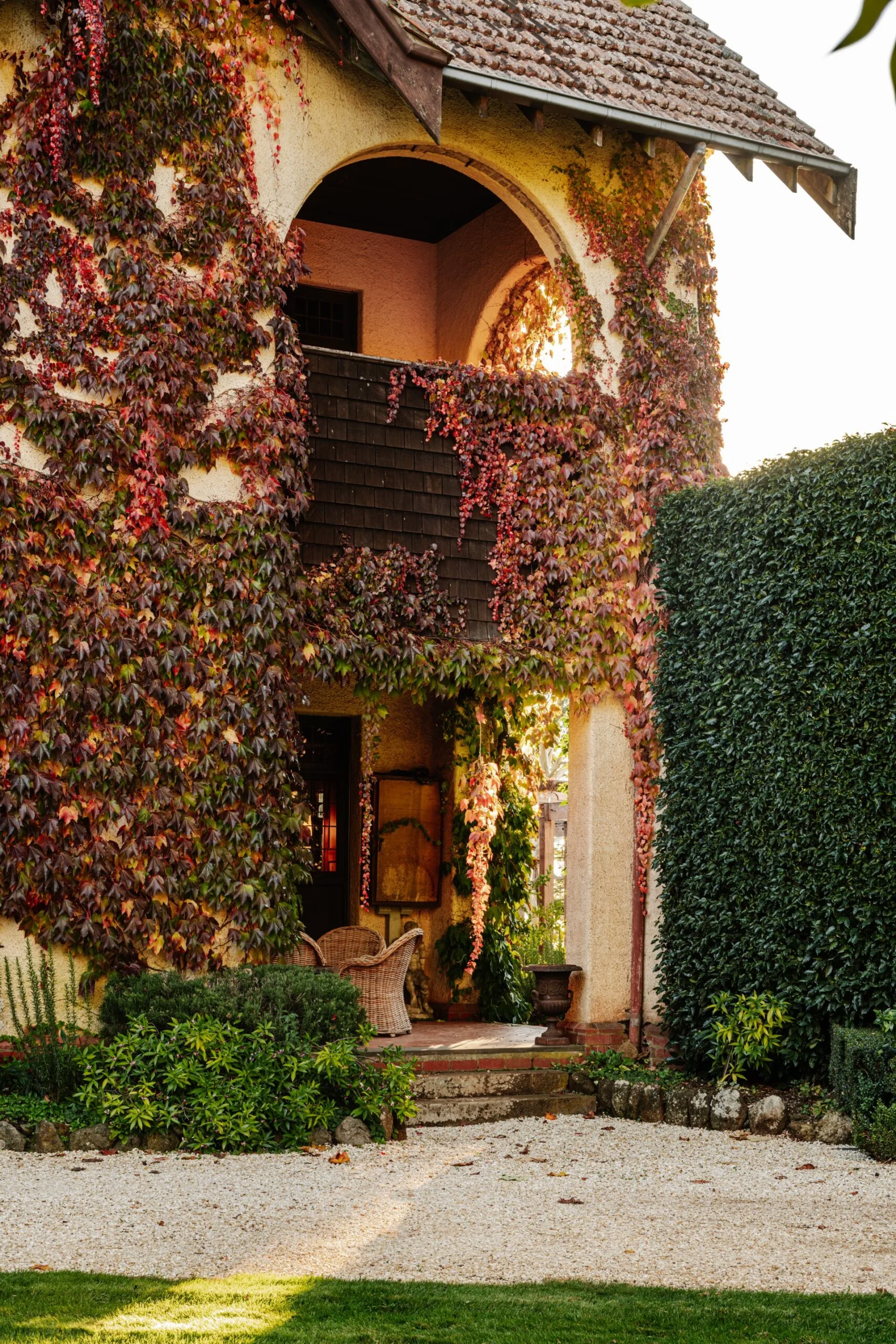 Built in 1910, the grand Arts and Crafts residence was English inspired, from its architecture to the leafy jacket of Boston ivy that covers it. The Boston ivy has turned brilliant shades of red, orange and deep purple as the photo was taken in Autumn.