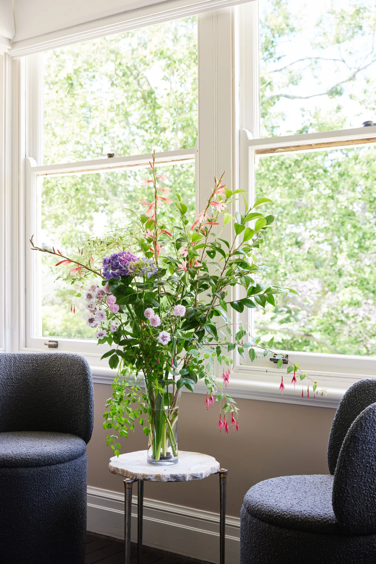 Blue Mountains home vase flowers armchairs window