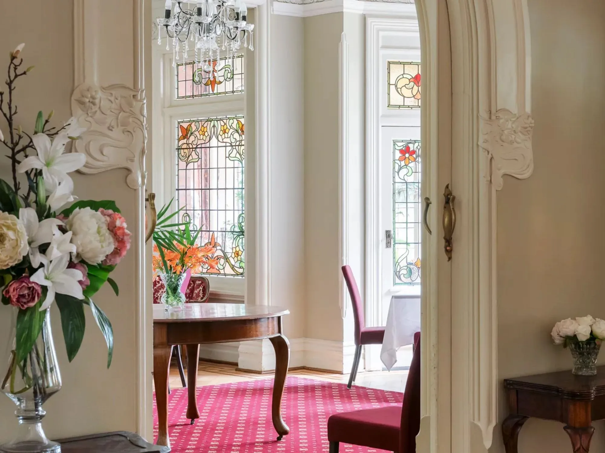 Stained leadlight windows and antique furniture at The Gables in Melbourne