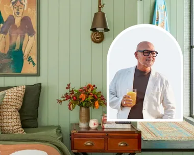 Neale Whitaker next to picture of bedroom