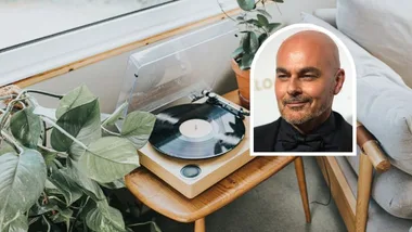 a modern vintage style record player on a small timber table surrounded by house plants with Neale Whitaker image inset