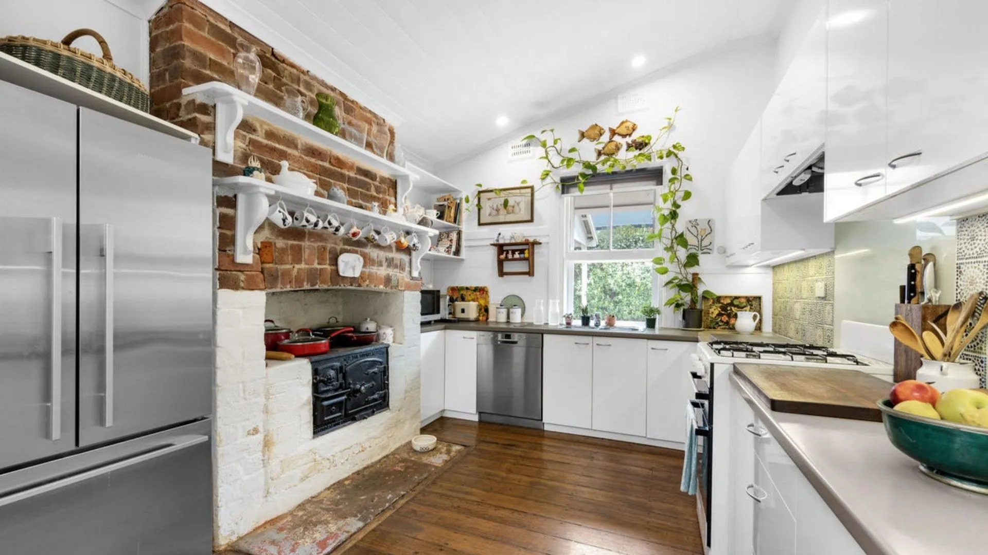 A kitchen with an antique Younger stove in Neale Whitaker's new home