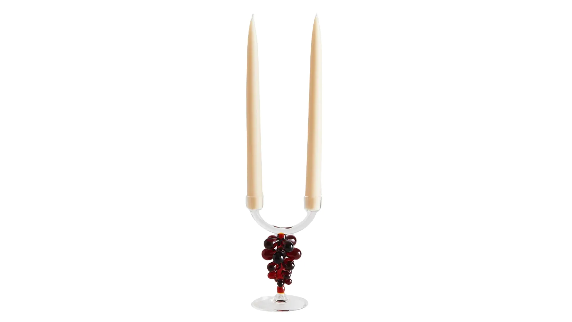 A glass candlestick holder, that fits two candlesticks, with a berry design on the handle, perfect for dark cottagecore styles.