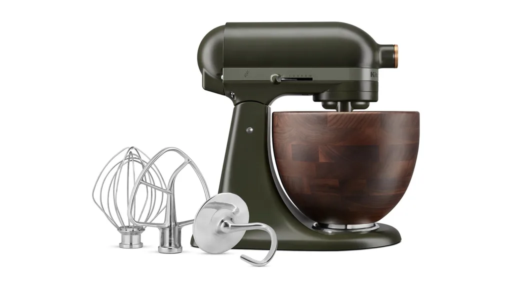 A dark green kitchenaid stand mixer with wooden bowl, perfect for dark cottagecore styles.