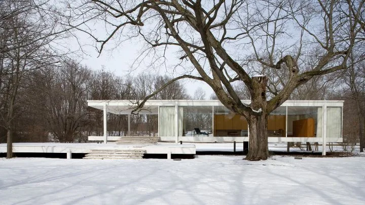 The exterior of Mies van der Rohe's Farnsworth House in the snow