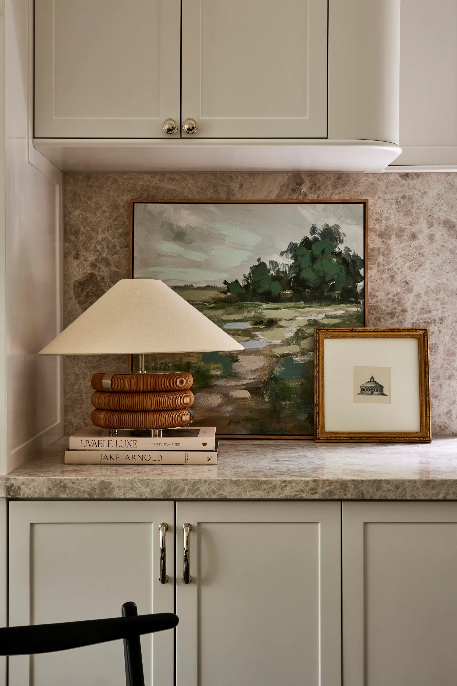 Gray and Co apartment artwork on benchtop