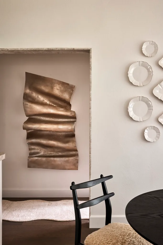 Gray and Co apartment with artwork on wall