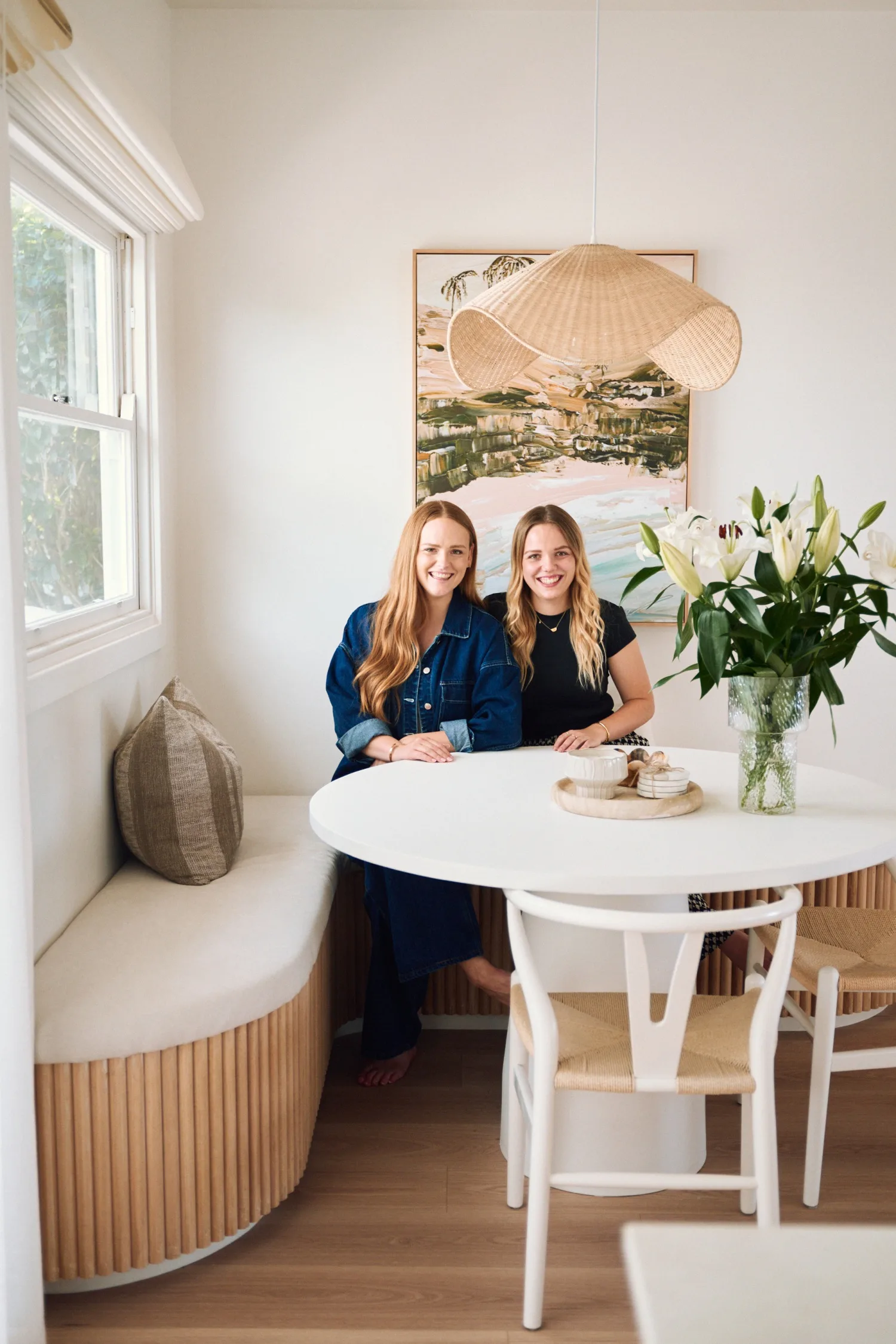 Maddy and Charlotte sitting in breakfast nook