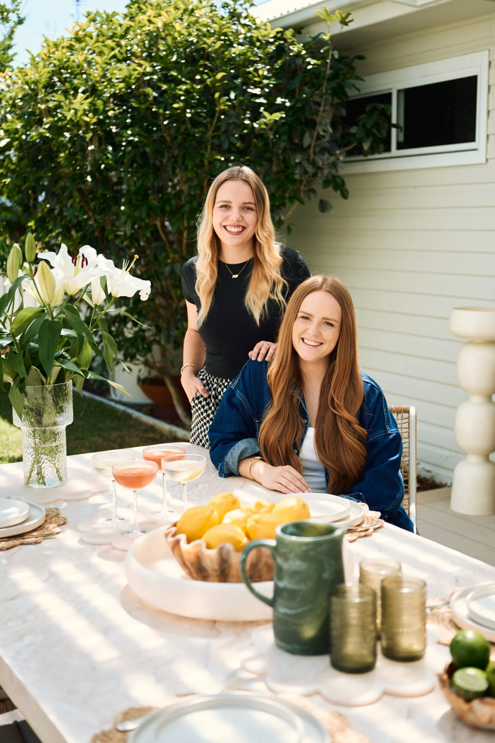 Maddy and Charlotte in Newcastle house flip backyard