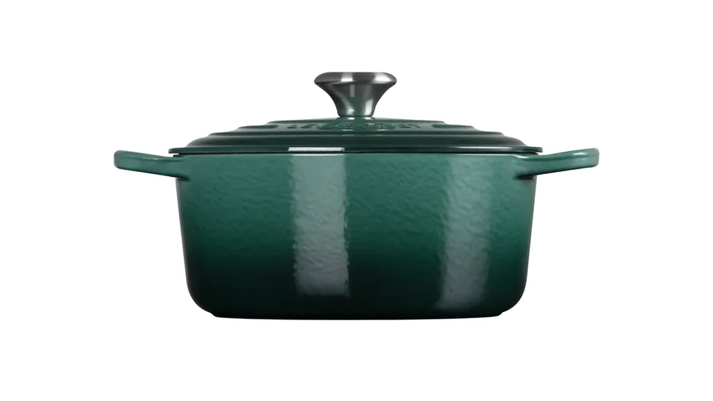 Deep green Le Creuset casserole dish with lid.