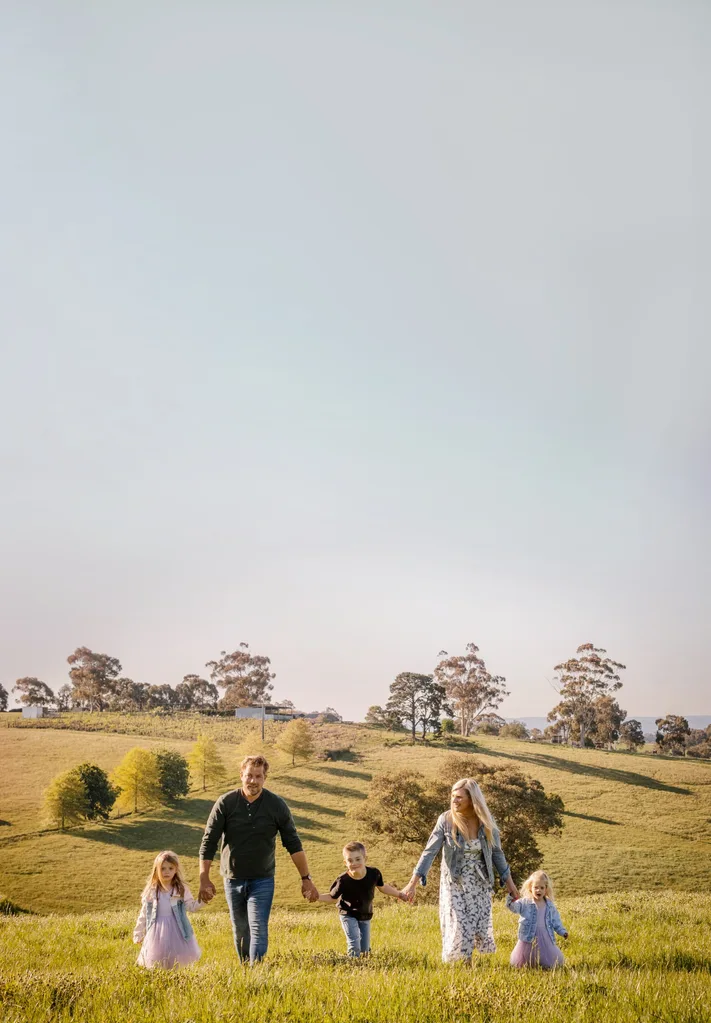 Garden designer Ashley James with his wife and children