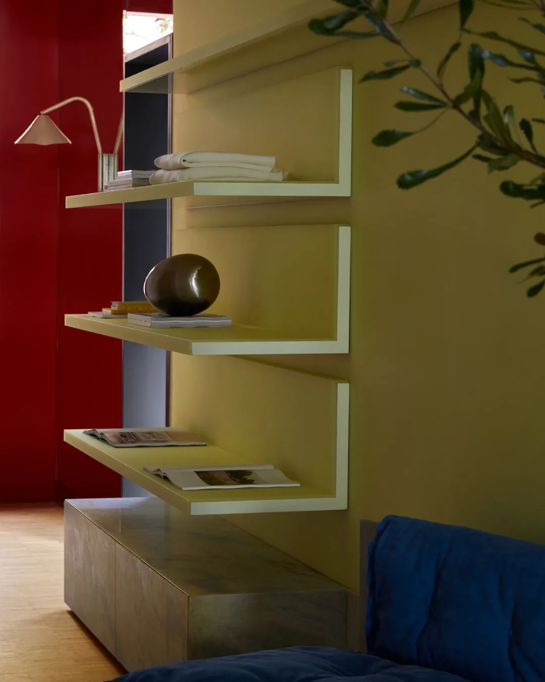 Yellow shelving with pops of red and blue in the Henne Paddington retail store