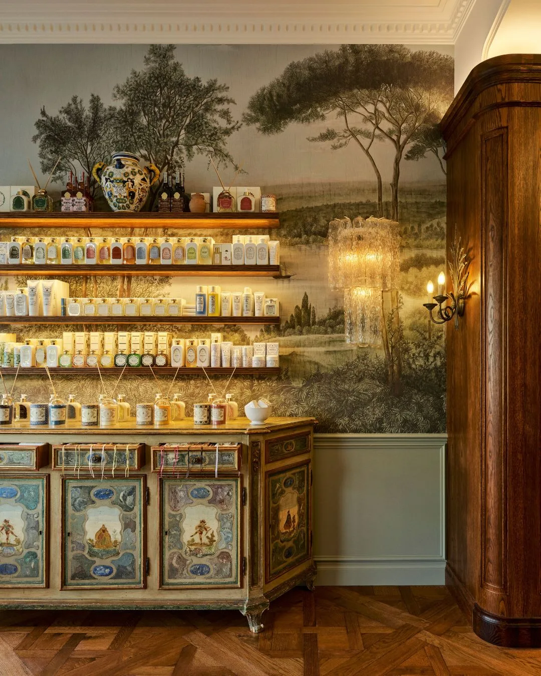 Antique cabinetry and scenic artistic wallpaper at the Libertine Perfumerie Melbourne retail store
