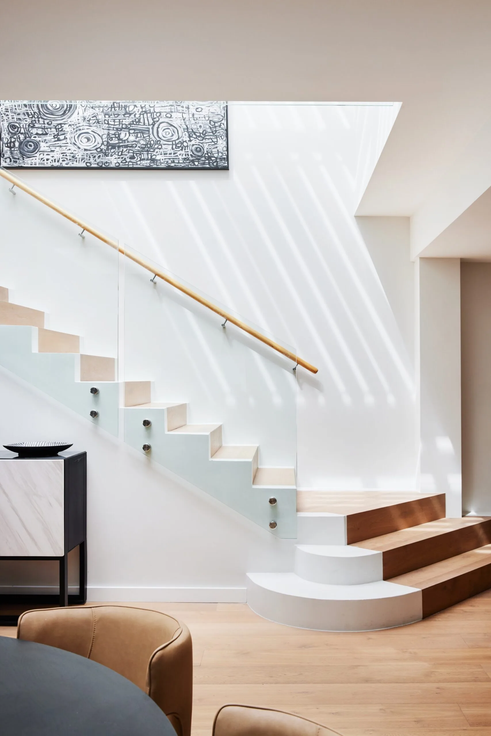 light staircase with white oak and glass railing