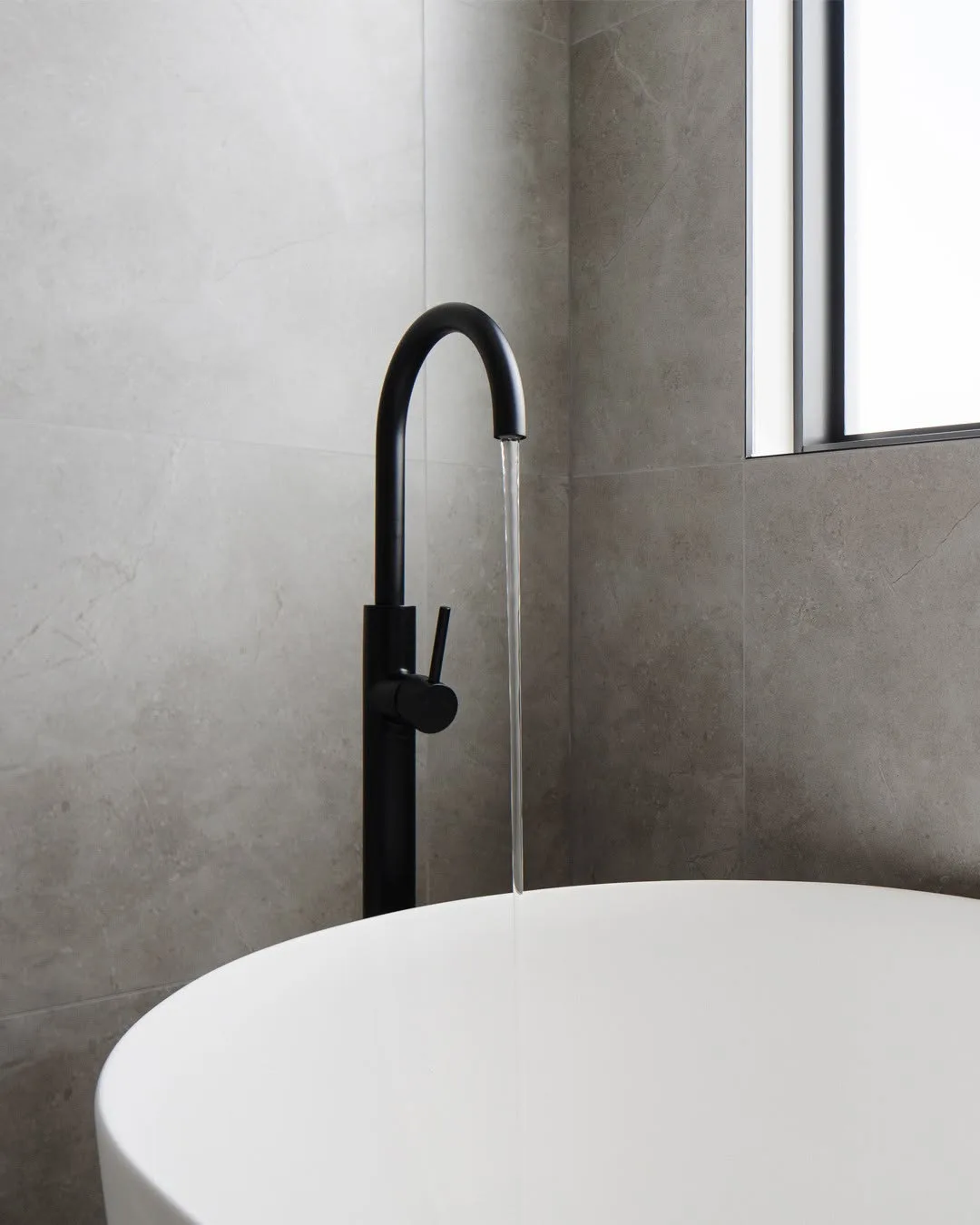 curved tap and bath