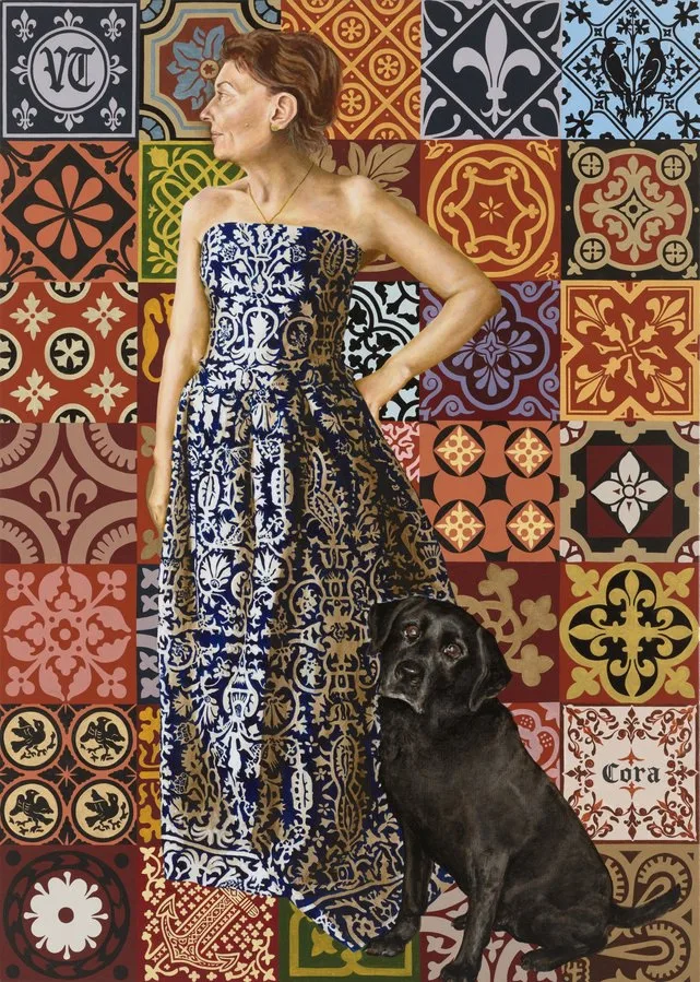An oil on linen portrait painting of Virginia Trioli. She is wearing a blue and white dress with an elaborate pattern. Her black dog is beside her and the background of the painting is elaborate patterned and colourful tiles, all painted.