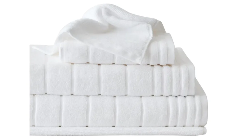 Set of white fluffy bath towels