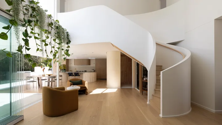 Sculptural, helix-inspired staircase by Kate Cooper Interiors and OGE Group Architects.