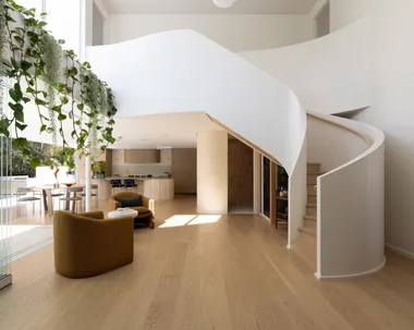 Sculptural, helix-inspired staircase by Kate Cooper Interiors and OGE Group Architects.
