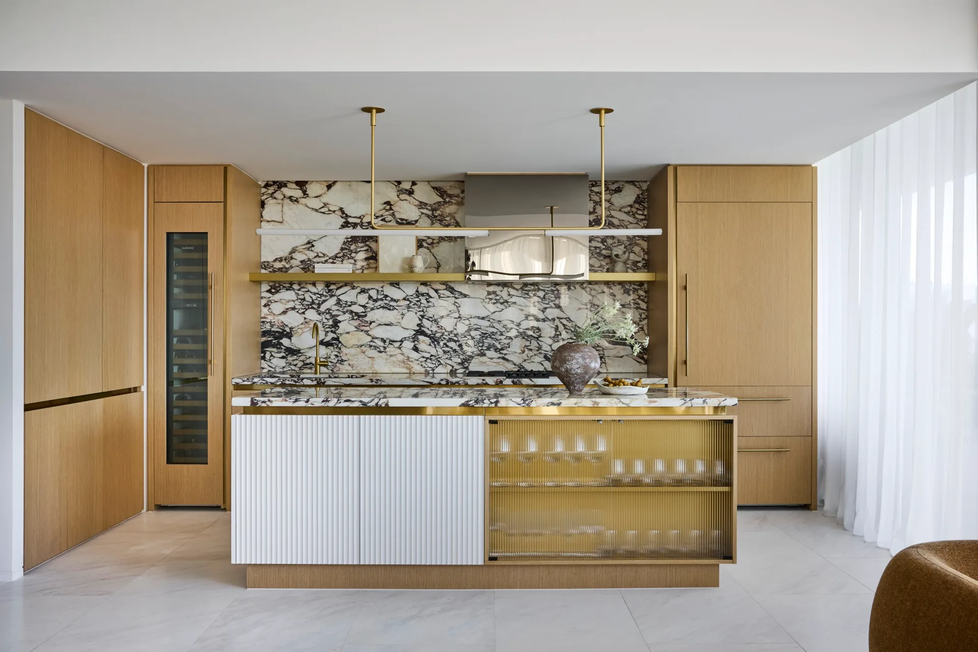 Lisa Santamaria interior design renovation on Lavender Bay apartment owned by Dianne kitchen marble light timber brass finishes