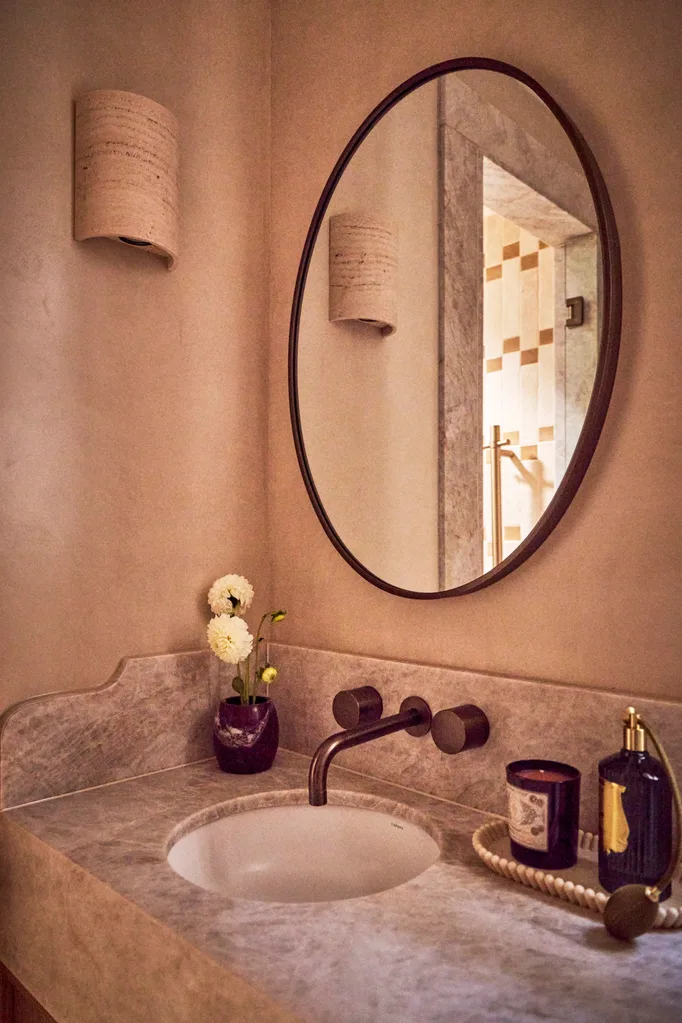 Vanity in Steph and Gian's ensuite with round mirror
